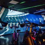 Les Mills Immersive Fitness edge-blended curved screens using Screen Goo Max Contrast projection coatings